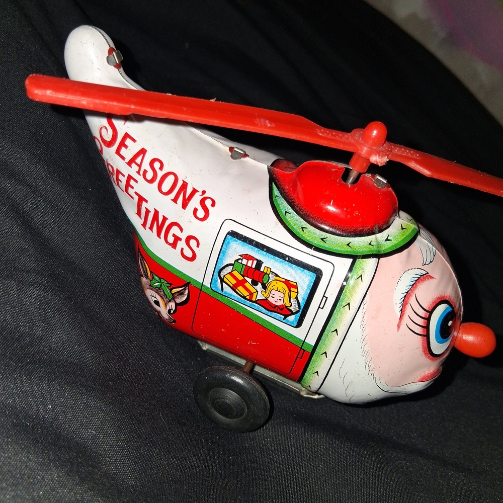 Vintage Tin Wind Up Santa Helecopter Toy